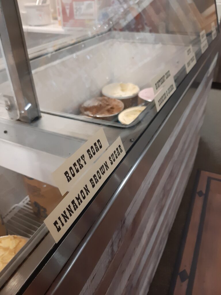 close up photo of ice cream counter with featured flavor